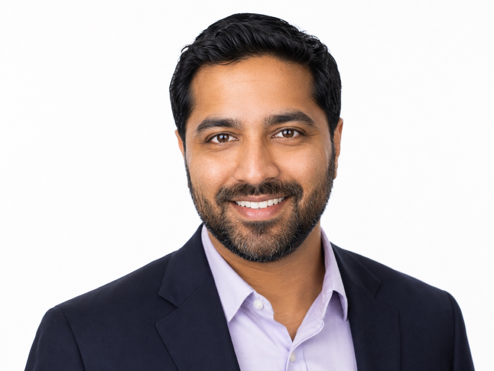 AI-generated corporate headshot example on a light studio background