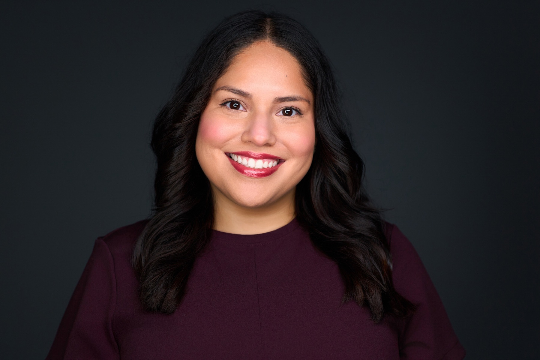 Professional business portrait with dark studio background